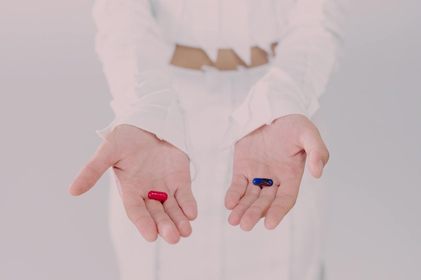 woman holding pills